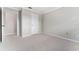 Neutral bedroom with closet and doorway, offering a serene and adaptable space for relaxation and personal touches at 1581 Monica Joy Cir, Longwood, FL 32779