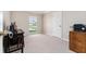 Versatile bedroom with natural light, a desk, and a printer, offering a flexible space for work or relaxation at 1581 Monica Joy Cir, Longwood, FL 32779