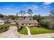 Charming one-story home with a well-manicured lawn, mature trees, and an attached garage at 1581 Monica Joy Cir, Longwood, FL 32779