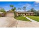 Single story home featuring a two car garage and a large green front yard with mature landscaping and walkways at 1581 Monica Joy Cir, Longwood, FL 32779