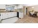 Bright kitchen showcasing granite counters and leads into a dining area with tile flooring at 1581 Monica Joy Cir, Longwood, FL 32779
