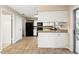 Well-lit kitchen with granite counters and black appliances flowing into other rooms at 1581 Monica Joy Cir, Longwood, FL 32779