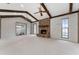 A spacious living room with a brick fireplace and two ceiling fans provides a cozy and inviting atmosphere at 1581 Monica Joy Cir, Longwood, FL 32779