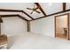 An expansive living room features vaulted ceilings with wood beams and lots of space for living and entertaining at 1581 Monica Joy Cir, Longwood, FL 32779