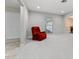 Bright living room with a comfortable red recliner, neutral walls, and ample natural light at 1581 Monica Joy Cir, Longwood, FL 32779