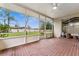 Spacious screened patio featuring brick floors and views of the backyard, perfect for outdoor relaxation and entertaining at 1581 Monica Joy Cir, Longwood, FL 32779