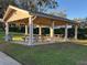 A covered picnic shelter with tables and benches, perfect for outdoor gatherings and picnics at 1581 Monica Joy Cir, Longwood, FL 32779
