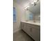 Bathroom featuring double vanity with tile floor and shower/tub combo at 17792 Adrift Rd, Winter Garden, FL 34787