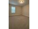 Bedroom featuring neutral carpet and a window at 17792 Adrift Rd, Winter Garden, FL 34787