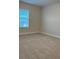Empty bedroom with carpet floors and a window for natural light at 17792 Adrift Rd, Winter Garden, FL 34787