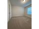 Bedroom with neutral carpet and a window at 17792 Adrift Rd, Winter Garden, FL 34787