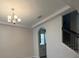 View of the dining area with chandelier and staircase at 17792 Adrift Rd, Winter Garden, FL 34787