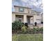 Inviting two-story home featuring a welcoming porch and lush landscaping at 17792 Adrift Rd, Winter Garden, FL 34787