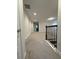 Carpeted hallway with staircase at 17792 Adrift Rd, Winter Garden, FL 34787