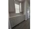 Bright kitchen features white cabinets, tile backsplash, quartz countertops, and stainless steel appliances at 17792 Adrift Rd, Winter Garden, FL 34787