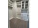 Walk-in closet featuring custom shelving, drawers, and ample storage space at 17792 Adrift Rd, Winter Garden, FL 34787