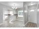 Modern kitchen features white cabinetry, an island with granite countertops, and stainless steel appliances at 1797 31St Nw St, Winter Haven, FL 33881
