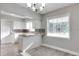 Charming kitchen features white cabinets, granite countertops, and a bright window with natural light at 1797 31St Nw St, Winter Haven, FL 33881