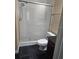 The bathroom features a shower with glass doors, toilet, and vanity at 2019 Dixie Belle Dr # 2019O, Orlando, FL 32812