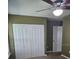 Bedroom with built-in closet and double folding doors at 2019 Dixie Belle Dr # 2019O, Orlando, FL 32812