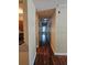 A long hallway with hardwood floors connects different areas of the home at 2019 Dixie Belle Dr # 2019O, Orlando, FL 32812