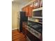 Kitchen featuring stainless steel appliances, granite countertops, and dark wood cabinets at 2019 Dixie Belle Dr # 2019O, Orlando, FL 32812