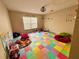 Spacious playroom with colorful floor mats, a large window, and ample space for activities at 2143 Tealwood Cir, Tavares, FL 32778