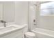 Bright bathroom featuring a modern vanity, shower and tub combination, and marble accents at 2252 Sw 168Th Loop, Ocala, FL 34473