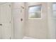 Modern bathroom featuring white marble tile shower with window and gold fixtures at 2252 Sw 168Th Loop, Ocala, FL 34473