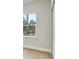 Bright bedroom with a large window offering a view of the surrounding trees and landscaping at 2252 Sw 168Th Loop, Ocala, FL 34473