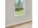 Bright bedroom with a large window offering a view of the surrounding grass and landscaping at 2252 Sw 168Th Loop, Ocala, FL 34473