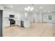 Bright, open-concept kitchen with white cabinets, stainless steel appliances, and spacious island at 2252 Sw 168Th Loop, Ocala, FL 34473
