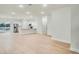 Spacious living room with light wood floors, open floor plan, and modern kitchen at 2252 Sw 168Th Loop, Ocala, FL 34473