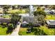 Aerial view of a home with a lush lawn, mature trees and easy water access at 2431 Westwood Dr, Longwood, FL 32779