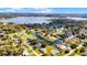 Scenic aerial shot of a residential neighborhood on canals, with a beautiful lake in the backdrop at 2431 Westwood Dr, Longwood, FL 32779