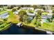 Aerial view showcasing the property's pool and lush landscaping, nestled along a waterfront at 2431 Westwood Dr, Longwood, FL 32779