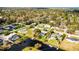 Aerial view of homes with canals, pools, docks, and mature trees at 2431 Westwood Dr, Longwood, FL 32779