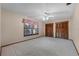 Bedroom featuring plush carpeting, large window, and a spacious closet with shuttered doors at 2431 Westwood Dr, Longwood, FL 32779