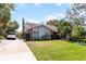 Charming home with a well-manicured lawn, mature landscaping, and a paved driveway at 2431 Westwood Dr, Longwood, FL 32779