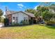 Charming home featuring well-maintained lawn, brick accents and lush landscaping at 2431 Westwood Dr, Longwood, FL 32779