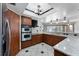 Well-lit kitchen featuring granite countertops, stainless steel appliances, and wooden cabinets at 2431 Westwood Dr, Longwood, FL 32779