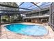 Private outdoor pool surrounded by screened enclosure with covered lounge area and upstairs balcony at 2431 Westwood Dr, Longwood, FL 32779