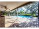 Relaxing covered patio featuring a private pool and serene views of the surrounding landscape at 2431 Westwood Dr, Longwood, FL 32779