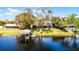 Waterfront home featuring a private boat dock and a scenic view of the calm, expansive lake at 2431 Westwood Dr, Longwood, FL 32779