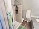 Bathroom featuring a walk-in shower and toilet at 25704 Aberdovey Ave, Sorrento, FL 32776