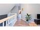 Upstairs hallway with modern railing, neutral walls, and stylish decor creating a welcoming atmosphere at 25704 Aberdovey Ave, Sorrento, FL 32776