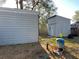 Large yard featuring sheds and a water pump system, with ample room for outdoor activities at 25704 Aberdovey Ave, Sorrento, FL 32776