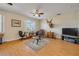 Laminate floored bonus room featuring lots of space, a ceiling fan, and natural light at 2631 Captains Ct, Kissimmee, FL 34746