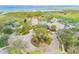 Aerial view of community clubhouse featuring manicured landscaping and a circular driveway at 2631 Captains Ct, Kissimmee, FL 34746