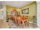 Formal dining room with a large wooden table, chairs, hutch and decorative chandelier at 2631 Captains Ct, Kissimmee, FL 34746